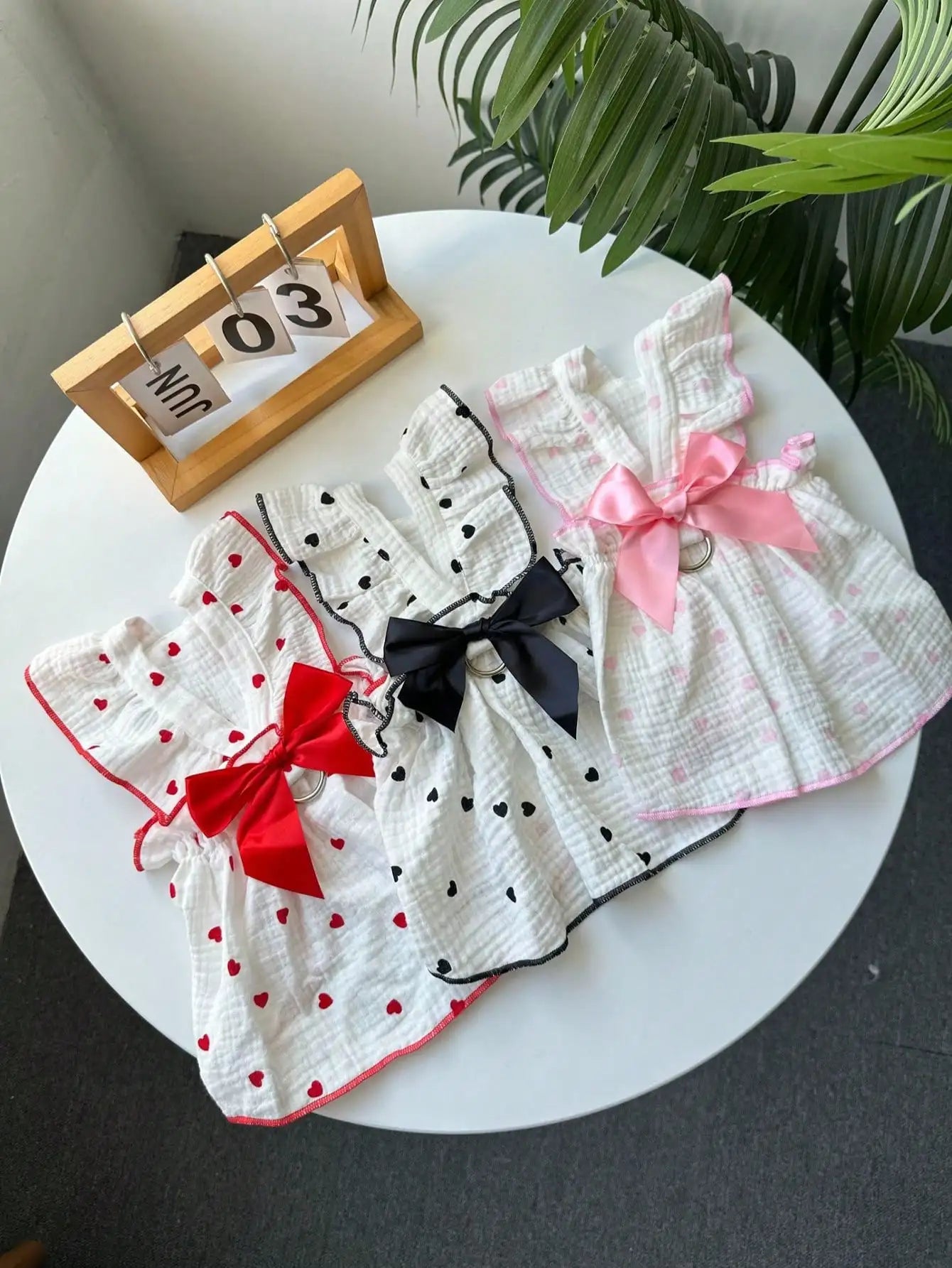 Pet Dresses And Supplies For Spring And Summer, Suitable For Dogs And Cats Like Teddy, Bichon Frise, And Pomeranian. Features Include Cute Love-Themed Dog Outfits.